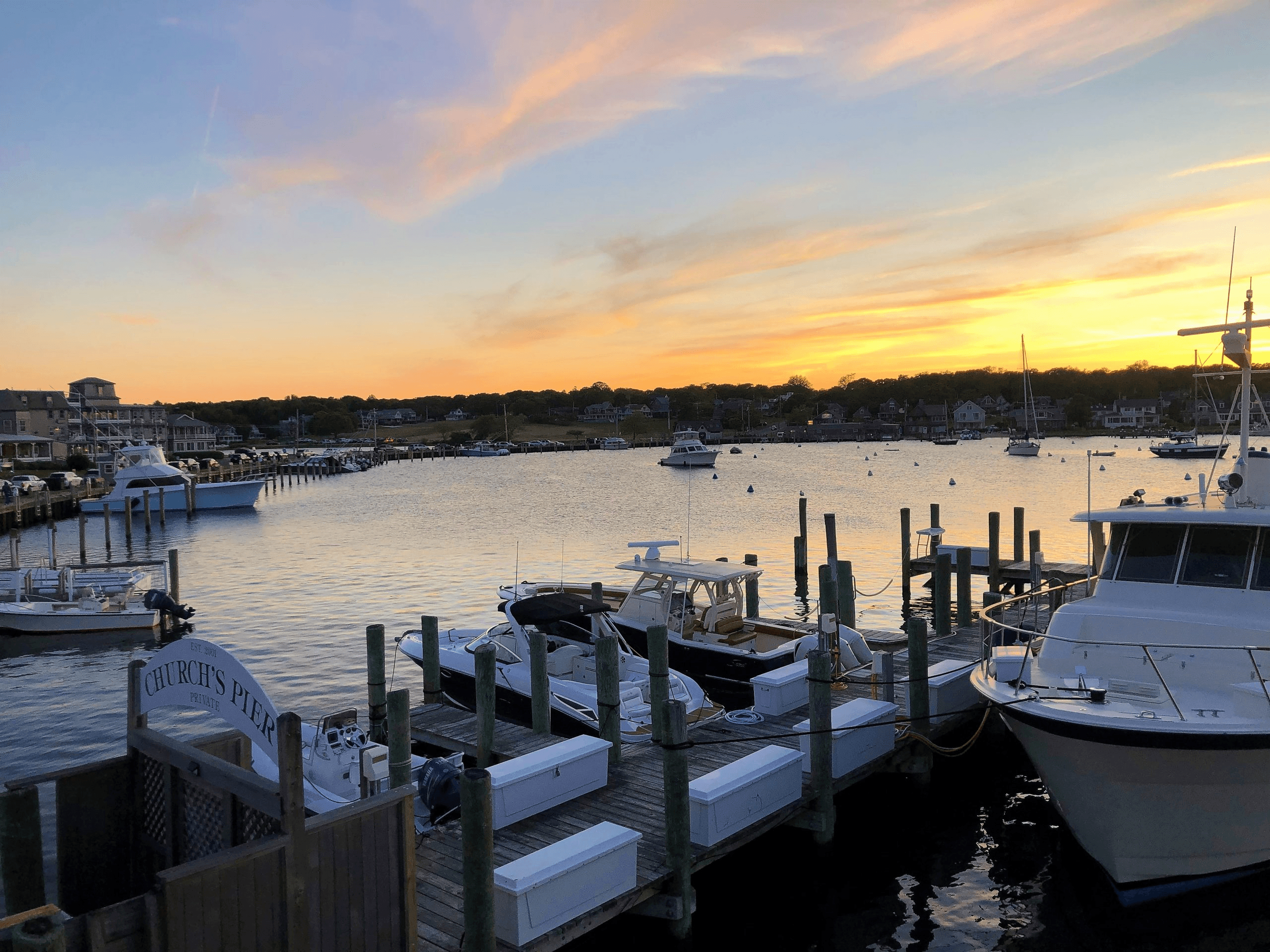 Boats in the Oak Bluffs Harbor at sunset